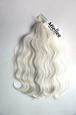 Frosty Blonde Seamless Tape Ins - Wavy Hair